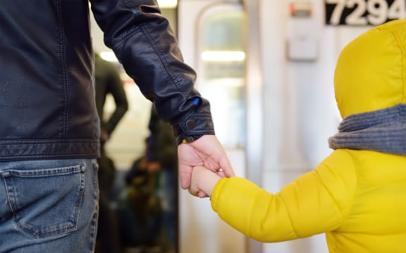 Man and child / son taking transport.