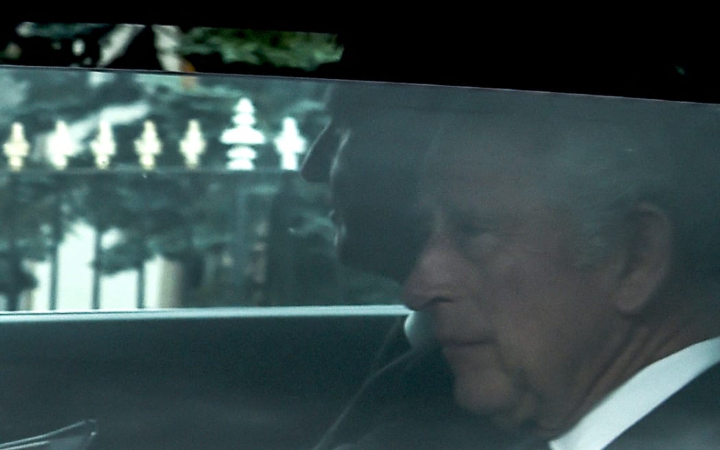 King Charles III (R) is driven away from Balmoral Castle in Ballater, a day after Queen Elizabeth II died.