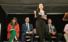 Lan Pham speaking at a candidates’ meeting during the 2022 general election