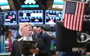 Traders work on the floor of the New York Stock Exchange on 1 November, 2016.
