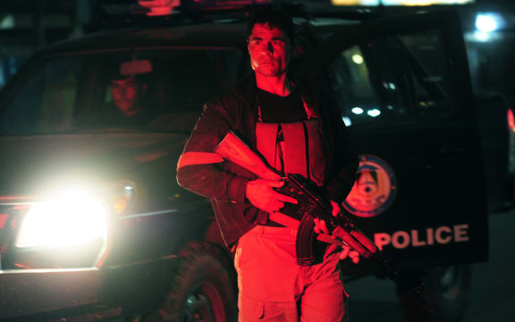 An Afghan policeman near the security perimeter of the Serena Hotel.
