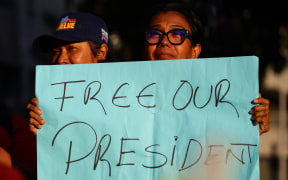 A woman holds a sign that reads, 'Free our president', during a march in support of Venezuelan President Nicolas Maduro and his wife Cilia Flores, both detained in the United States, in Caracas, Venezuela, on January 4, 2025.