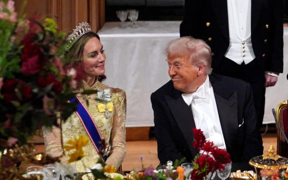 US President Donald Trump smiles at Britain's Catherine, Princess of Wales during a State Banquet at Windsor Castle, in Windsor, on September 17, 2025, during the US President's second State Visit. US President Donald Trump arrived in Britain for an unprecedented second State Visit, with the UK government rolling out a royal red carpet welcome to win over the mercurial leader. (Photo by Yui Mok / POOL / AFP)