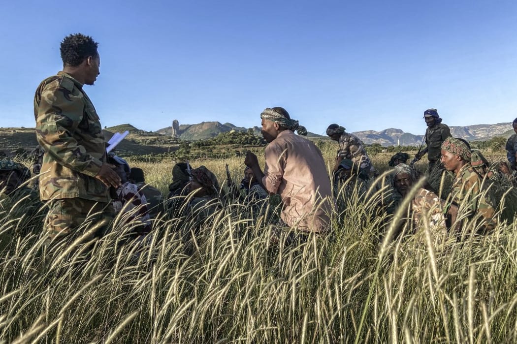 Amhara militia men, that combat alongside federal and regional forces against northern region of Tigray, receive training in the outskirts of the village of Addis Zemen.