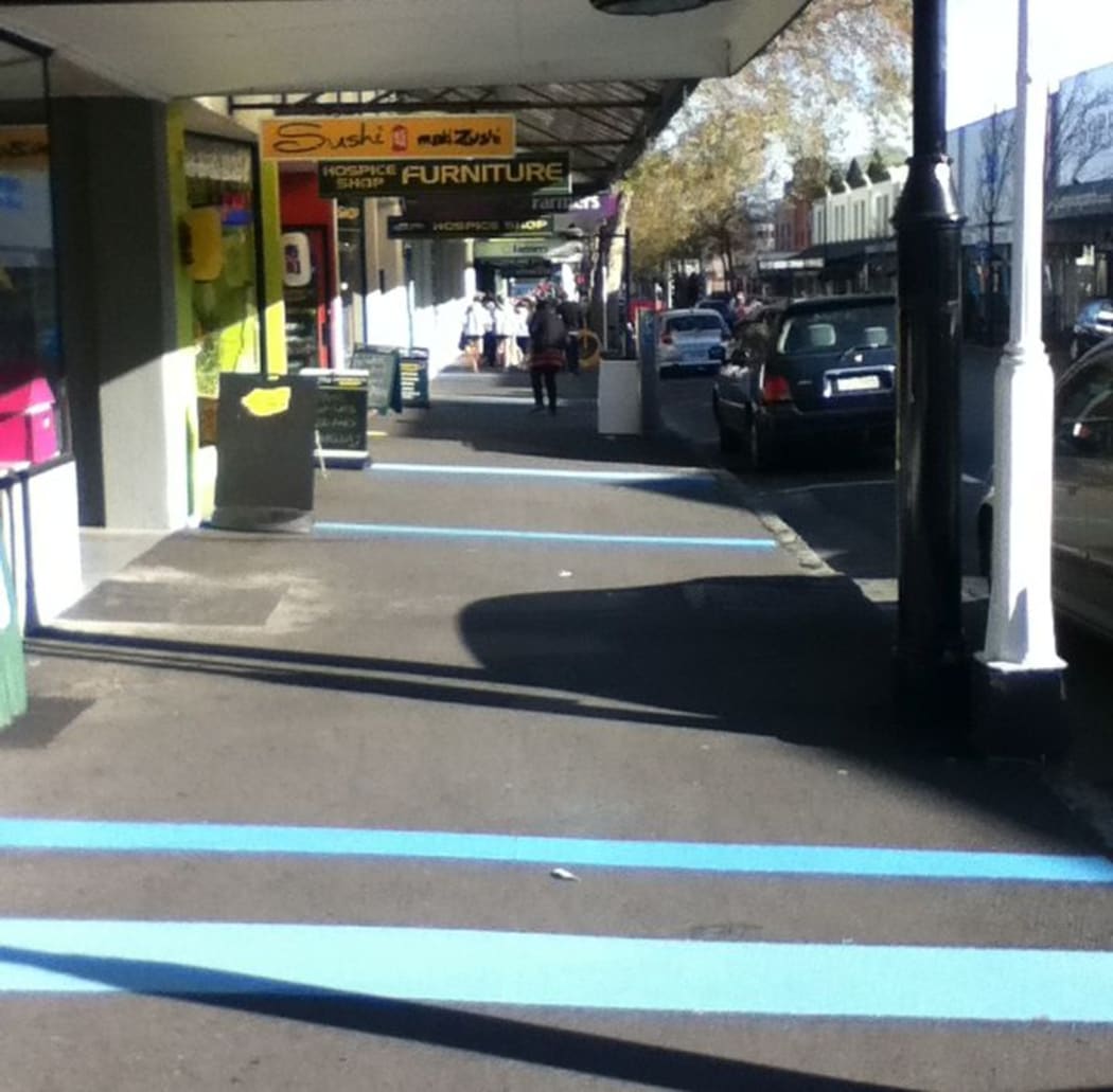 Bright blue bands of coloured glass beads have been laid out on the pavement on Bridge Street, in a move the council says is designed to make shoppers feel more at ease.