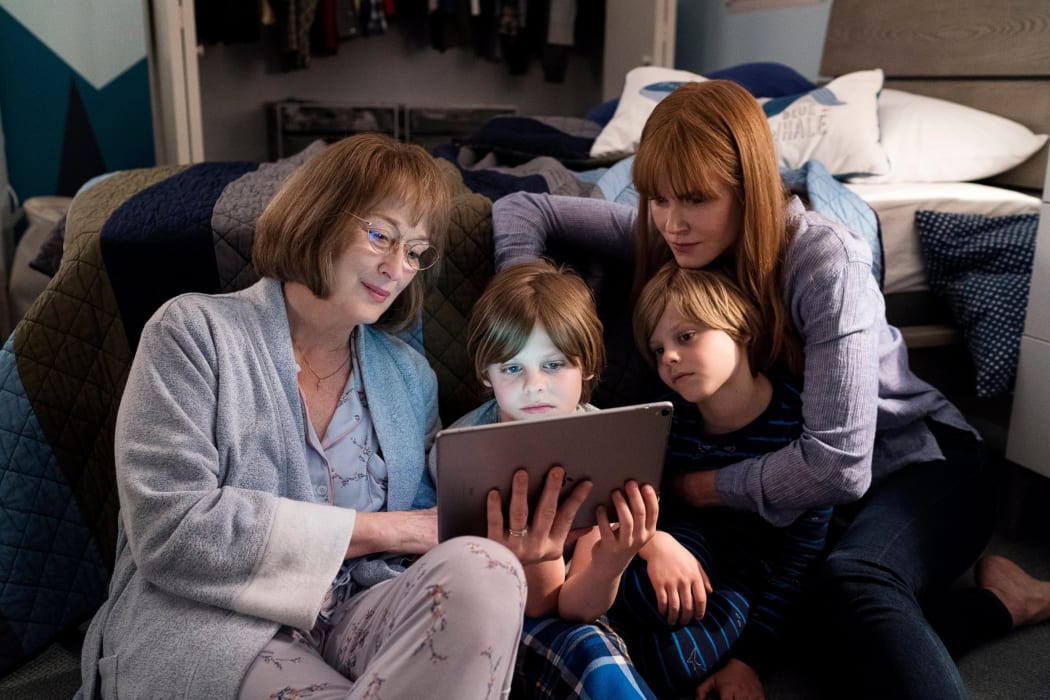 Mary Louise (Meryl Streep) and Celeste (Nicole Kidman) reading to the twins, Josh and Max (Cameron and Nicholas Crovetti).