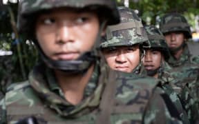 Soldiers secured the compound of the National Broadcasting Services.