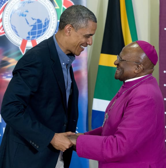 File photo: US President Barack Obama (L) chats with Nobel peace laureate Archbishop Desmond Tutu following a tour of the Desmond Tutu HIV Foundation Youth Centre in Cape Town in 2013