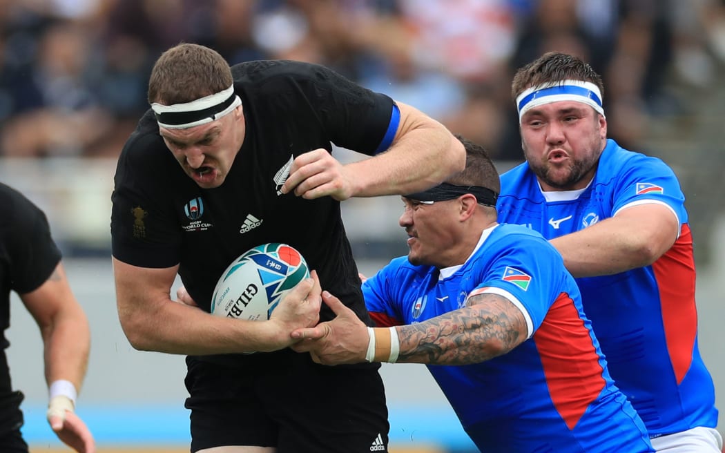 New Zealand's Brodie Retallick struggles to keep a ball during the first half of the Pool B match in the 2019 Rugby World Cup Japan against Namibia