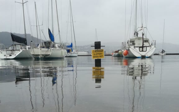 Slippery when wet sign under water
