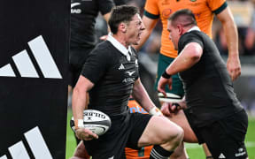 Cam Roigard celebrates his try.