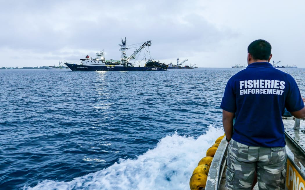 A Marshall Islands Fisheries Enforcement Officer heads out to conduct document checks and inspections of an arriving purse seiner in port Majuro prior to start of tuna transshipment operations