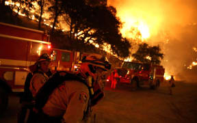 Firefighters prepare to start a backfire operation ahead of the Rocky Fire.