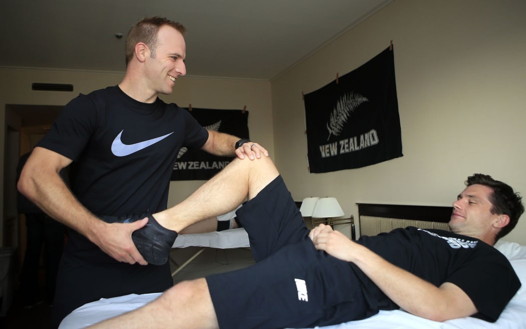 New Zealand Football physio Mark Fulcher treating All Whites keeper Jacob Spoonley in 2014.