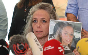 Keren Shem, the mother of French-Israeli woman Mia Shem held hostage by Hamas in Gaza, speaks to the press in Tel Aviv on October 17, 2023, amid the ongoing battles between Israel and the Palestinian group Hamas.