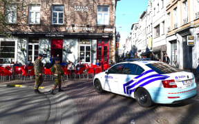 A police car blocks access to De Meir, Antwerp's main pedestrian street, after a man drove down it at speed.