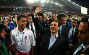 AC Milan's president Silvio Berlusconi (R) and Brazilian football star Ronaldo (L) arrive for the Champions League final football match against Liverpool at the Olympic Stadium, in Athens, 2007.