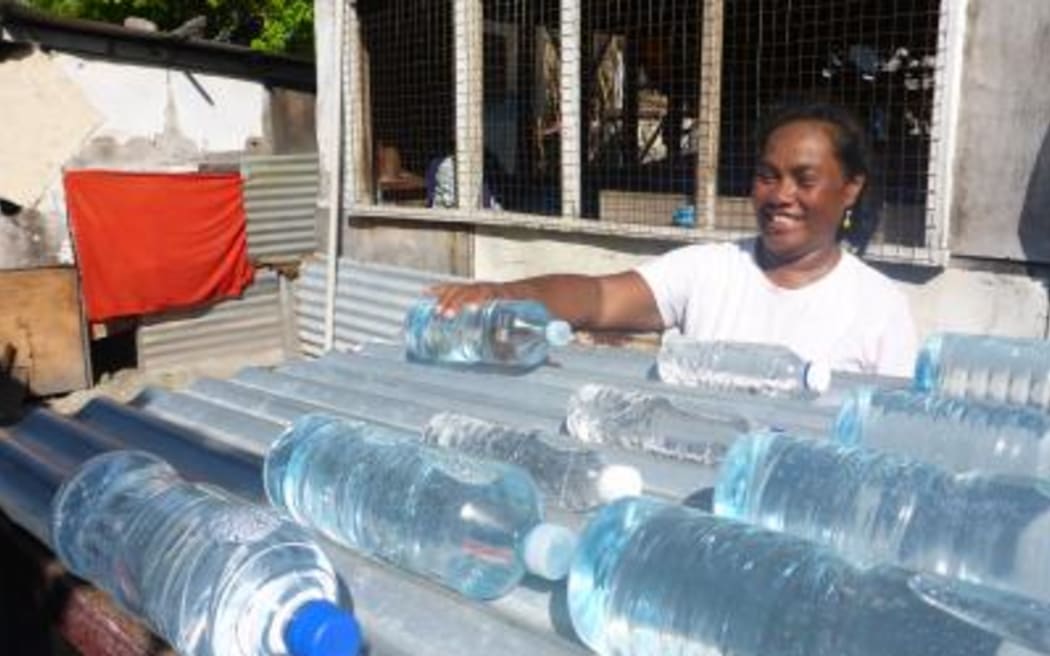 Kiribati is promoting a new solar water disinfection method involving heating  plastic water bottles on corrugated iron.