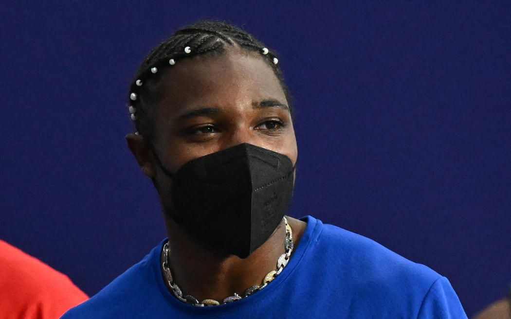 US' Noah Lyles wearing a mask leaves after the men's 200m final of the athletics event at the Paris 2024 Olympic Games at Stade de France in Saint-Denis, north of Paris, on August 8, 2024. (Photo by Jewel SAMAD / AFP)