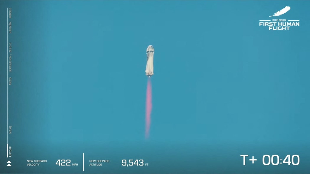 Blue Origin's New Shepard flies into space from the launch pad, 20 July 2021.