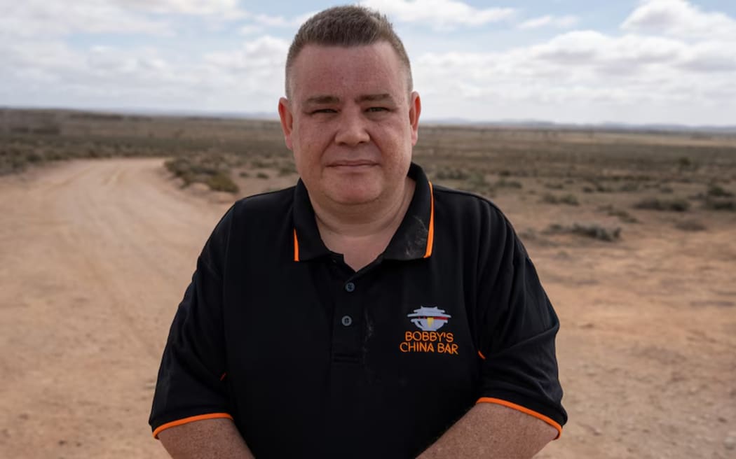Robert Head owns a mobile food truck and Bobby's China Bar in Peterborough and has travelled to the property near Yunta to feed volunteers.