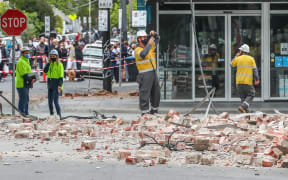 MELBOURNE, AUSTRALIA - SEPTEMBER 22: People are seen examining damaged buildings along Chapel Street following an earthquake on September 22, 2021 in Melbourne, Australia. A magnitude 6.0 earthquake has been