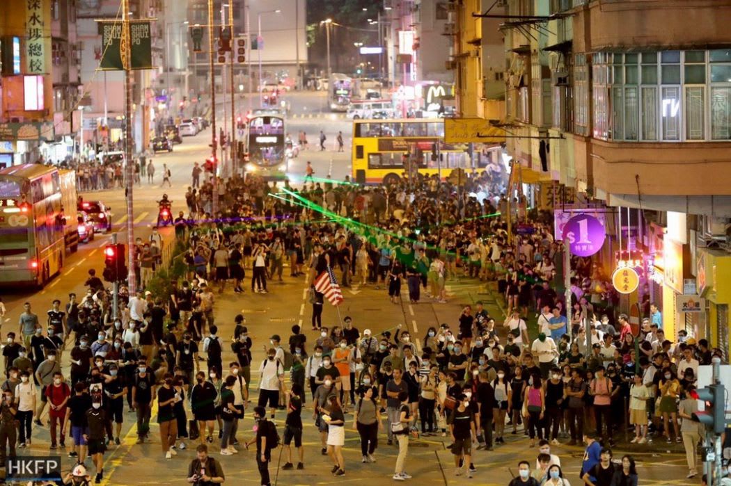 Protestors rally against apparent police brutality in Hong Kong. Photo