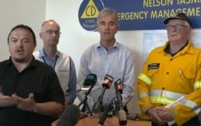 Tasman Mayor Richard Kempthorne (middle) giving an update on the fire with Civil Defence Controller Roger Ball (second from left) and Fire and Emergency.