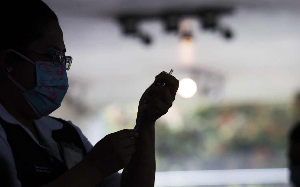 Free application, at the Vasconcelos Library, of the second dose of the Pfizer vaccine against COVID-19, for people from 40 to 49 years who live in the Miguel Hidalgo borough in Mexico City, Mexico, on July 14, 2021. (Photo by Cristian Leyva/NurPhoto) (Photo by Cristian Leyva / NurPhoto / NurPhoto via AFP)