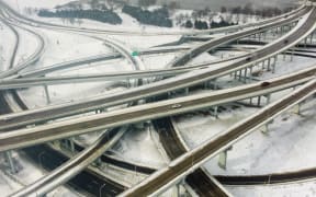 Vehicles move along a highway in Louisville, Kentucky, under freezing temperatures on December 23, 2022.