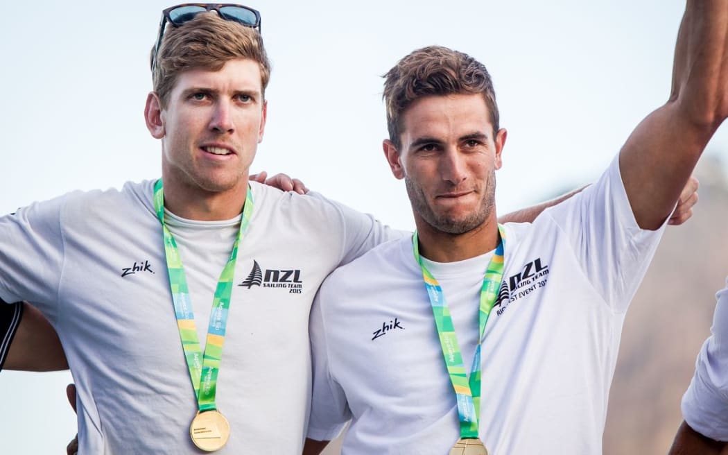 Burling and Tuke wear their gold medals on the dais at the Olympic Test Event, 2015.