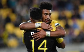 Hurricanes players Vince Aso and Ardie Savea celebrate a try.
