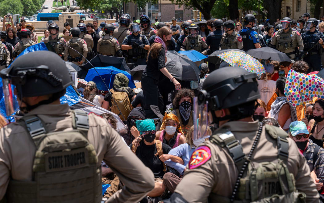 A pro-Palestinian protesters and Texas State Troopers at the University of Texas in Austin, Texas, on 29 April, 2024.