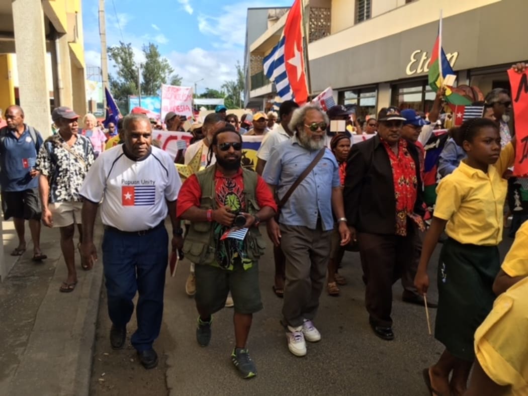 Hundreds of ni-Vanuatu, and West Papuan representatives, march to the Melanesian Spearhead Group secretariat in Port Vila.