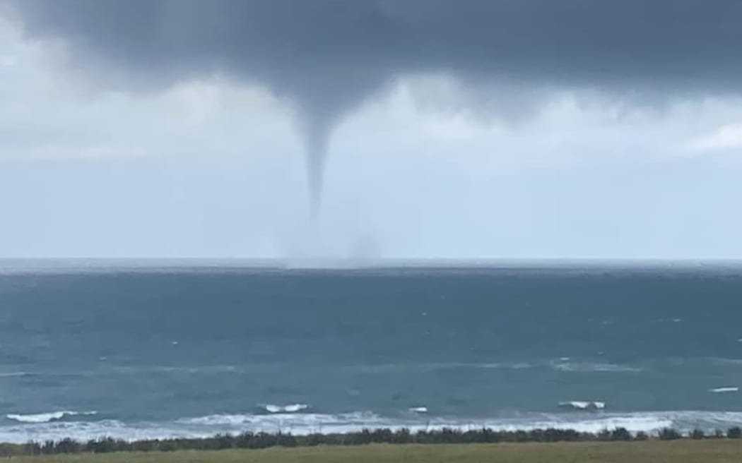 A West Coast business owner had a lucky escape after watching a waterspout tear towards her luxury lodge.