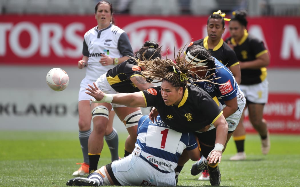 Wellington forward Janet Taumoli offloads in the tackle during the Auckland Storm vs Wellington Pride Farah Palmer Cup rugby game 2019.