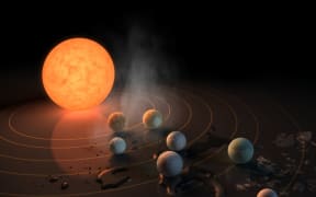 Artist's impression of the TRAPPIST-1 star, an ultra-cool dwarf, has seven Earth-size planets orbiting it.