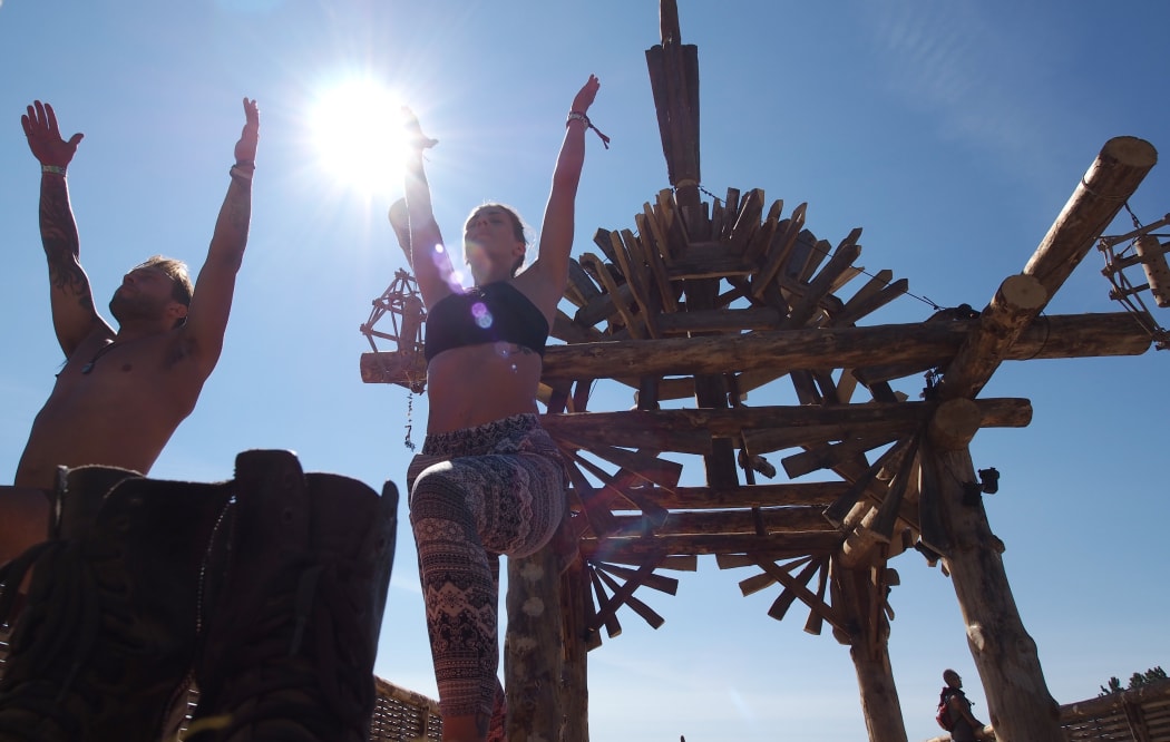 Festival goers practice yoga at the Solar Temple at the Oregon Eclipse Festival, on August 19, 2017, a venue for the event.