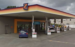 Two of the five men who broke into the petrol station using an axe are still on the run.