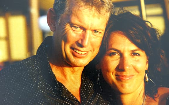 A photo of the couple standing close