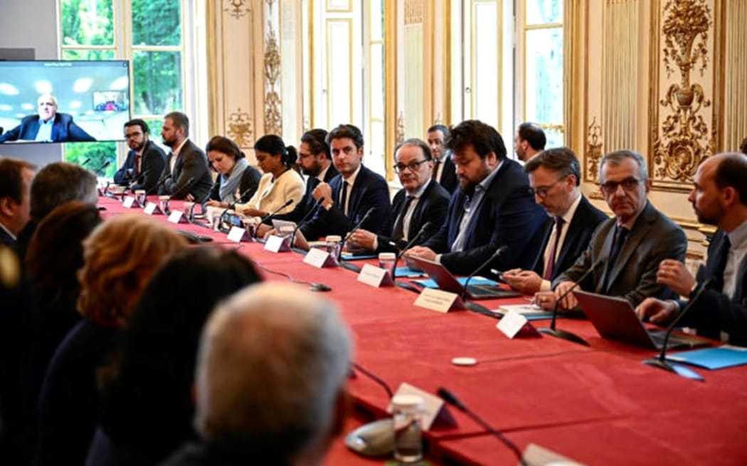 French Prime Minister Gabriel Attal, centre, hosts a parliamentary liaison committee on the situation in New Caledonia.