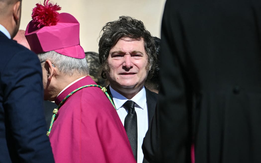 Argentina's President Javier Milei (C) arrives for late Pope Francis' funeral ceremony at St Peter's Square at the Vatican on April 26, 2025. (Photo by Alberto PIZZOLI / AFP)