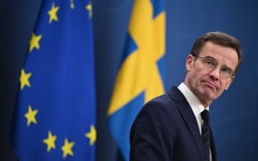 Sweden's Prime Minister Ulf Kristersson attends a press conference after Hungary's parliament has voted yes to ratify Sweden's NATO accession, in Stockholm, Sweden, on February 26, 2024. Swedish Prime Minister Ulf Kristersson said it was a "historic day," after Hungary's parliament ratified Sweden's NATO bid, clearing the final obstacle for the Nordic country to join the military alliance. (Photo by Jonathan NACKSTRAND / AFP)