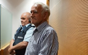 William Godfrey Wood, accompanied in the dock by a prison officer during sentencing in the Nelson District Court, on Tuesday 10 December, 2024.