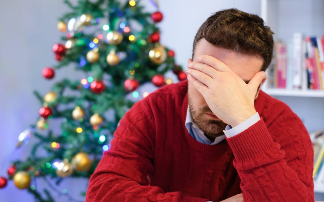 Man in solitude feeling bad during christmas day