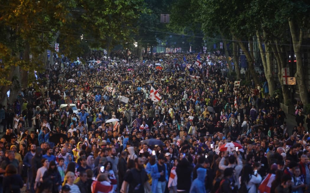 Protesters march during a rally against the controversial "foreign influence" bill in Tbilisi on May 11, 2024. The Black Sea Caucasus nation has been gripped by mass anti-government protests since April 9, after the ruling Georgian Dream party reintroduced the bill, which critics see as repressive. (Photo by Giorgi ARJEVANIDZE / AFP)
