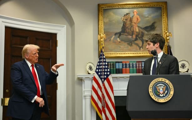 US President Trump gestures as CEO of Open AI Sam Altman speaks in the Roosevelt Room at the White House on January 21, 2025, in Washington, DC. (Photo by Jim WATSON / AFP)