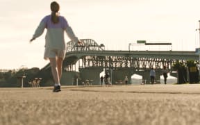 Exercise and social distancing near Auckland's Harbour Bridge during level 4 lockdown.