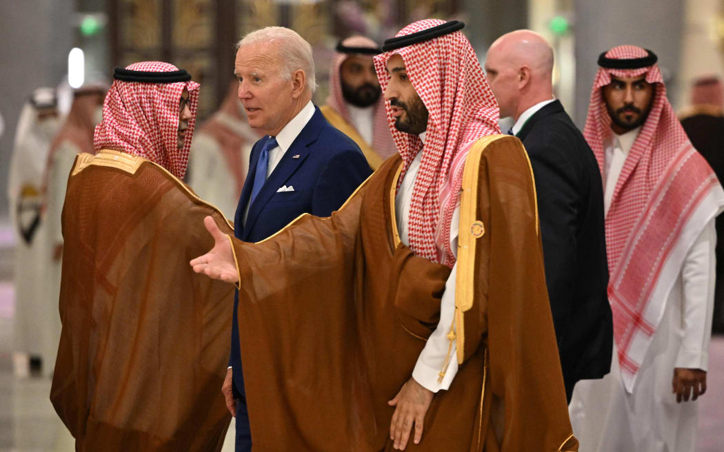 US President Joe Biden (C-L) and Saudi Crown Prince Mohammed bin Salman (C) arrive for the family photo during the Jeddah Security and Development Summit (GCC+3) at a hotel in Saudi Arabia's Red Sea coastal city of Jeddah on July 16, 2022. (Photo by MANDEL NGAN / POOL / AFP)