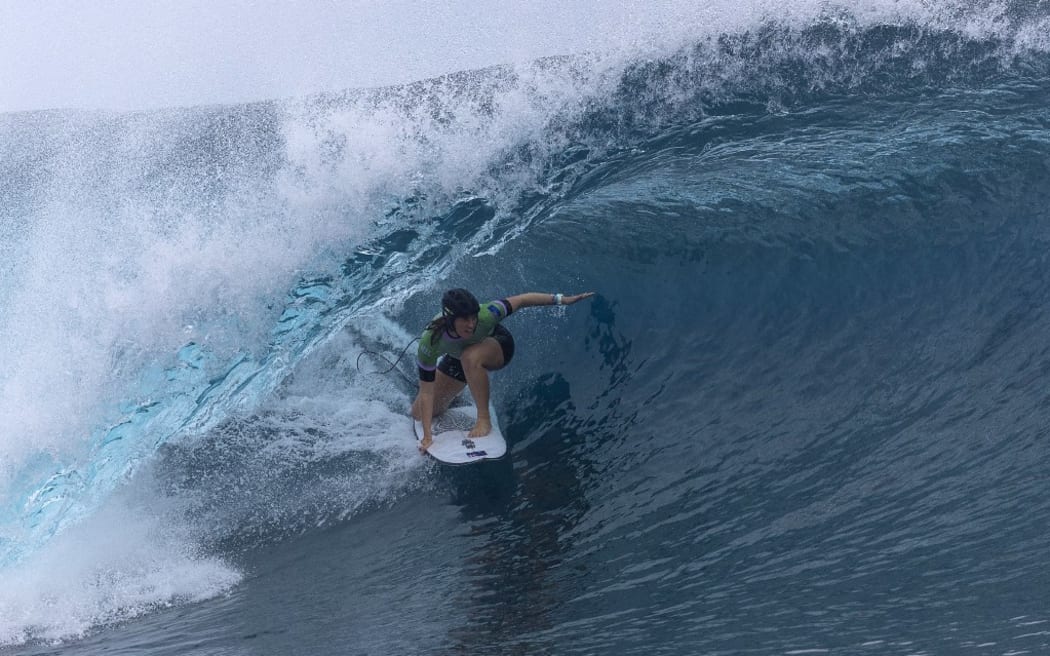 New Zealand's Saffi Vette rides a wave during round one of surfing during the Paris 2024 Olympic Games on July 27, 2024 in Teahupo'o, French Polynesia. (Photo by Ed Sloane / POOL / AFP)